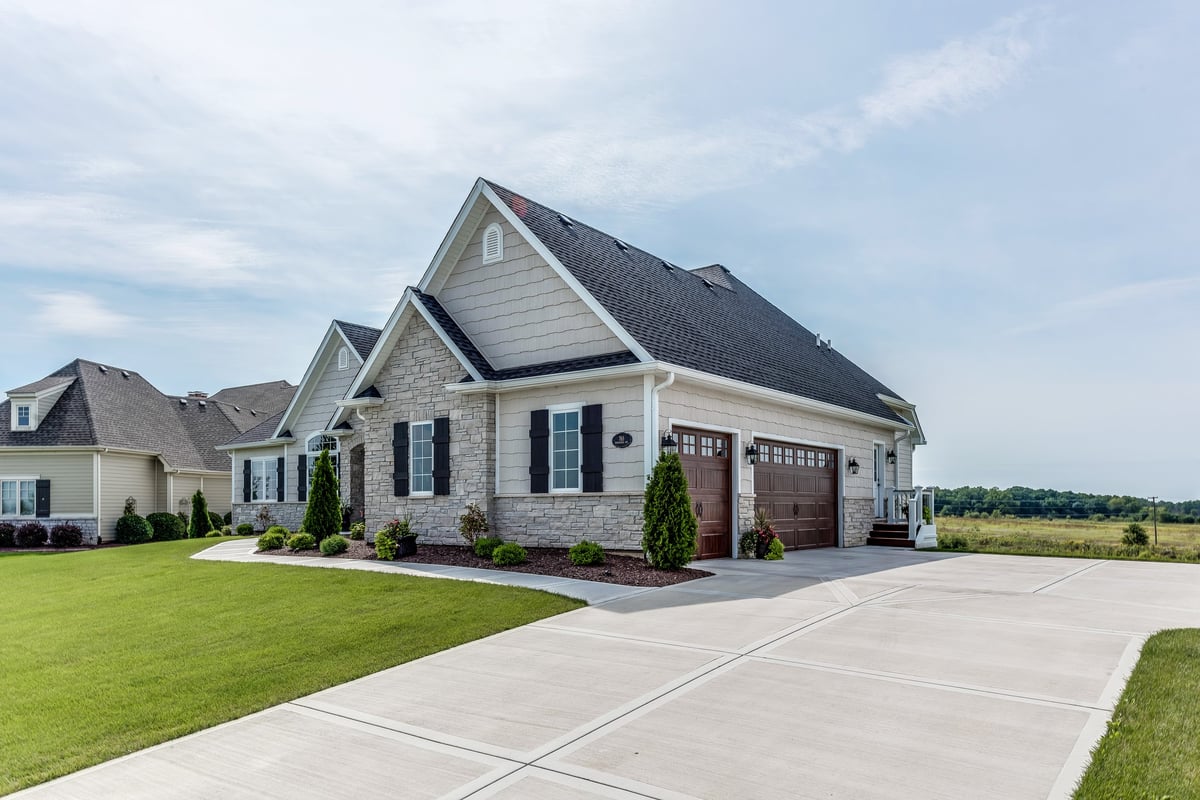 Three car garage with wide driveway