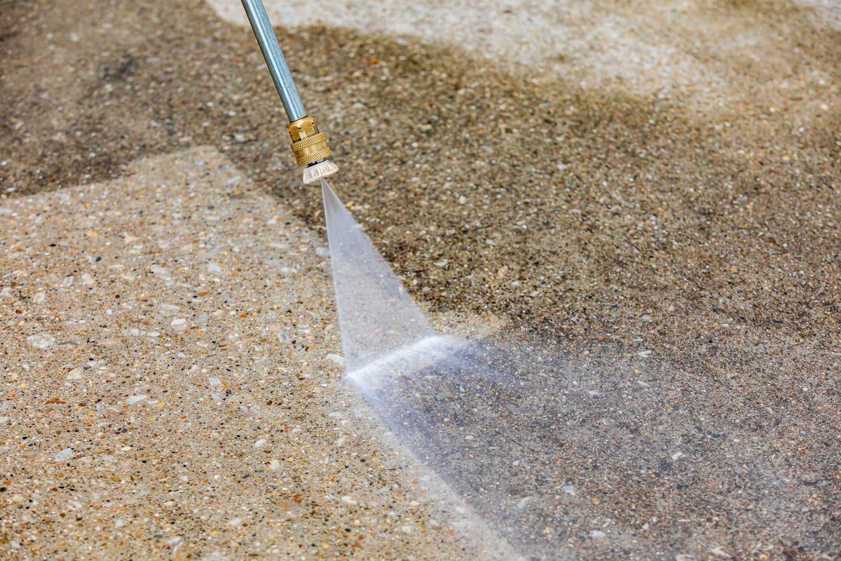 Pressure washing concrete surface