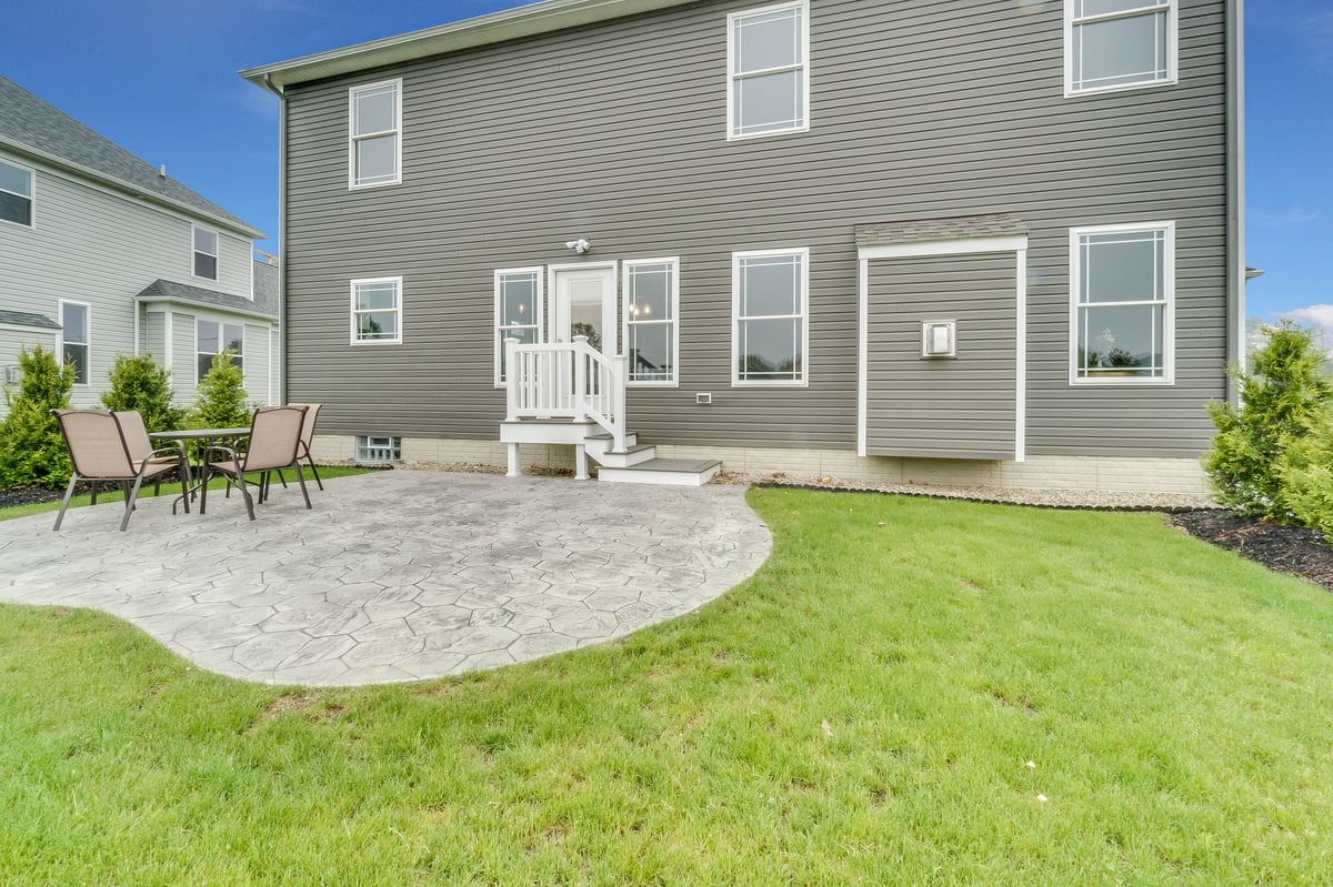 Brand new concrete patio and grass
